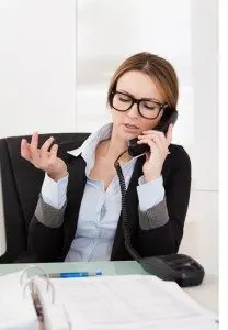 Beautiful Businesswoman Talking On Telephone In Office
