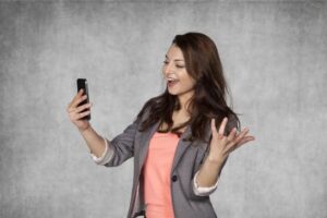 Happy business woman reading email