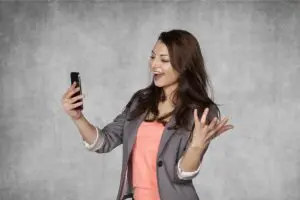 Happy business woman reading email