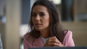 Business woman talking meeting. Young executive discuss corporate data in office Business woman talking meeting. Young executive discuss corporate data in office