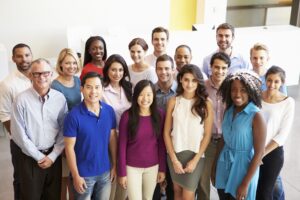 Portrait Of Multi-Cultural Office Staff Standing In Lobby