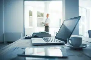 Executive standing in his office