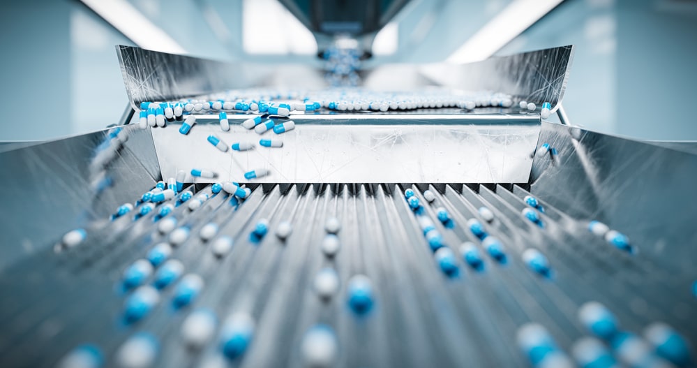 Sorting pharmaceutical capsules by a sorting machine on a production line pharmaceutical supply chain