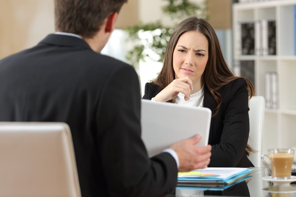Salesman trying to convince a doubtful customer Salesman trying to convince a doubtful customer
